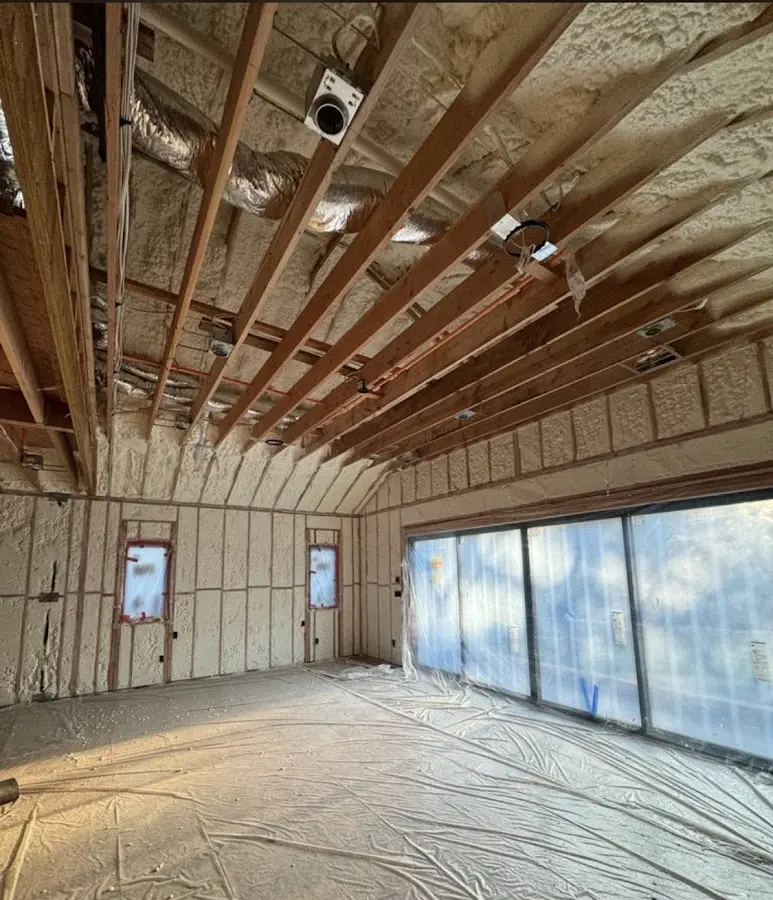 Interior walls and ceiling insulated with spray foam during new construction in Manchester-by-the-Sea